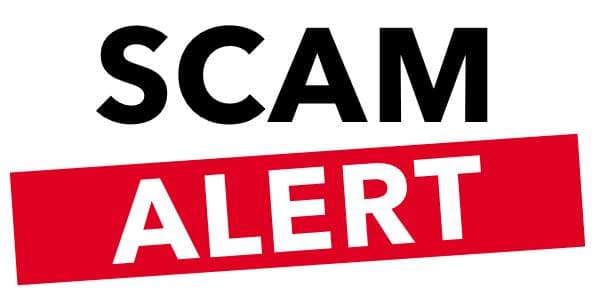 Warning message on a laptop screen alerting user about a phishing scam email.
